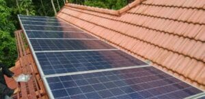 Solar Off Grid System Panels Mounted Over a Conventional Tiled Roof