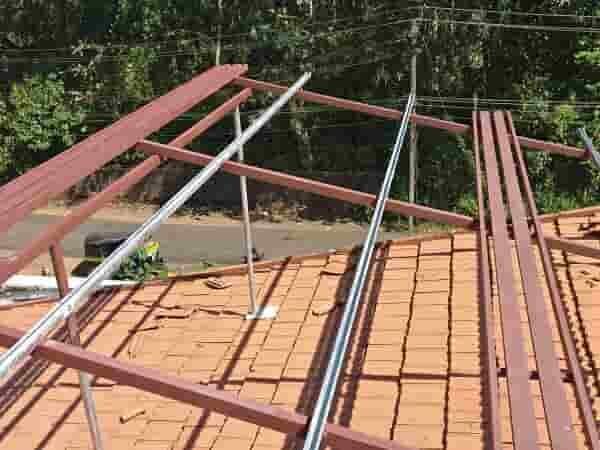 Solar Panels Mounted Over Tiled Roof With Walkways